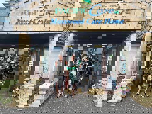 Staff dressed for Great Gatsby Party pose outside Mosswood Care Home.